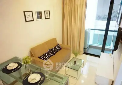 Modern living room with glass dining table and cozy sofa, opening to a balcony with city view.