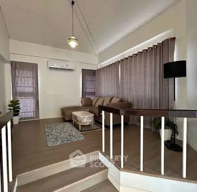 Spacious living room with modern decor and cozy seating area