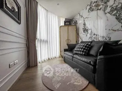 Stylish living room with marble accent wall and elegant decor