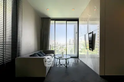 Modern living room with city view, sleek sofa, and wall-mounted TV in high-rise apartment.