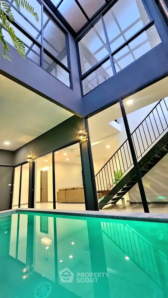 Modern luxury home with indoor pool and stylish staircase