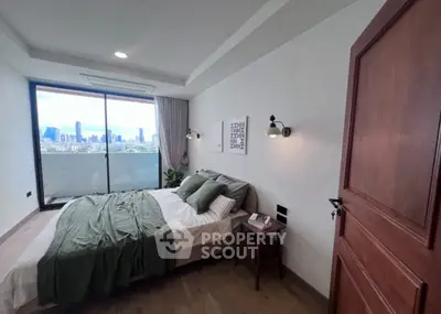 Modern bedroom with city view, featuring cozy bed and stylish decor.