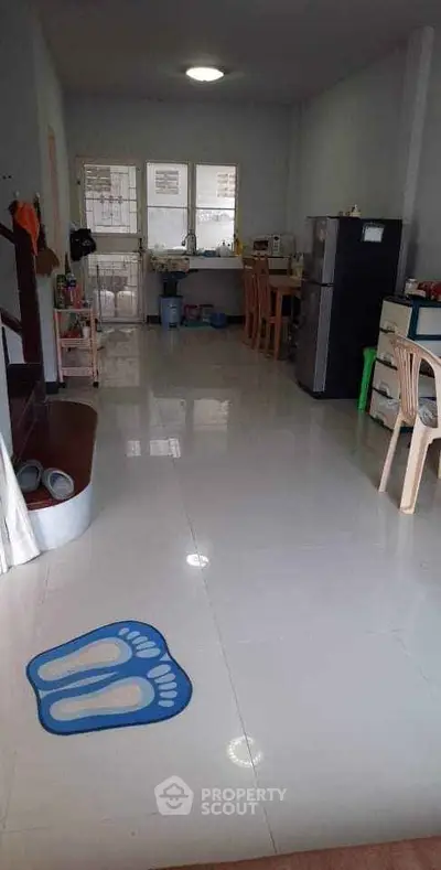 Spacious open-plan kitchen and dining area with modern appliances.