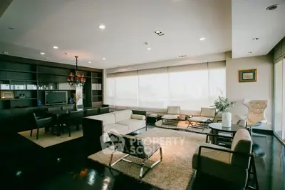 Luxurious modern living room with elegant furniture and panoramic city view.
