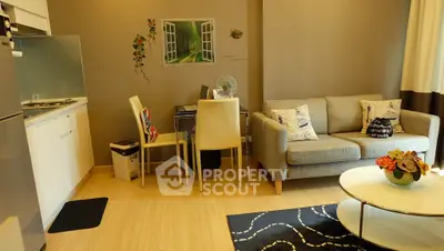 Cozy modern living room with stylish decor and open kitchen layout