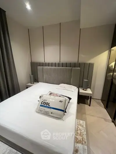 Modern bedroom with stylish headboard and cozy lighting