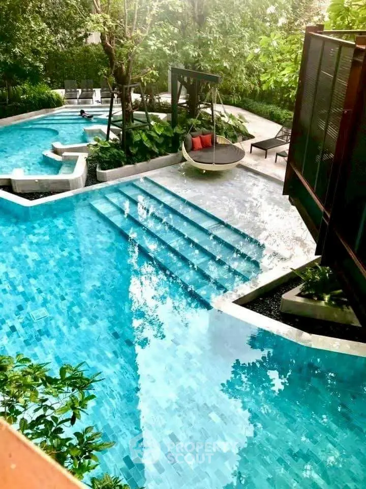 Luxurious outdoor pool area with lush greenery and modern design, perfect for relaxation and leisure.