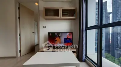 Modern living room with TV and city view through large windows in high-rise apartment.