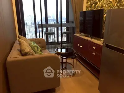 Stylish living room with city view, modern furniture, and balcony access in urban apartment.