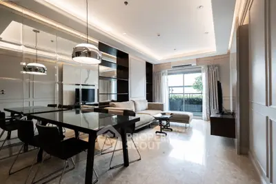 Luxurious modern living room with elegant dining area and large windows offering natural light.