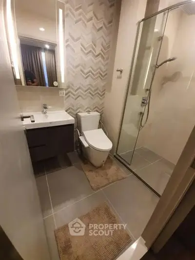 Modern bathroom with sleek design and glass shower enclosure