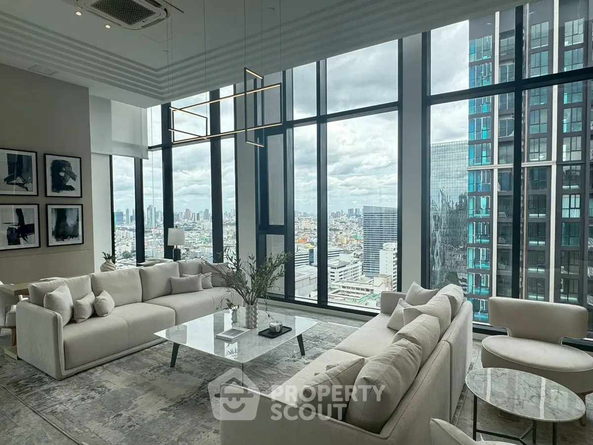 Luxurious modern living room with panoramic city views and elegant furnishings.