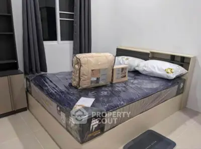 Modern bedroom with new bed and stylish decor in a cozy apartment.