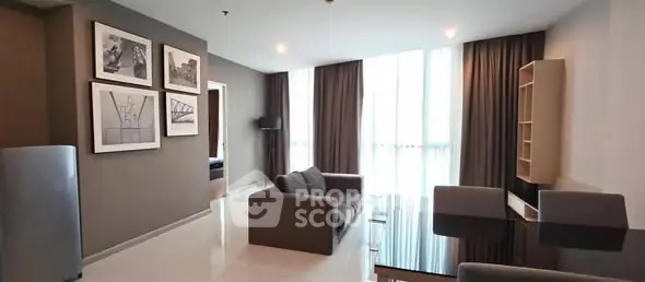 Spacious modern living room with elegant decor and large windows