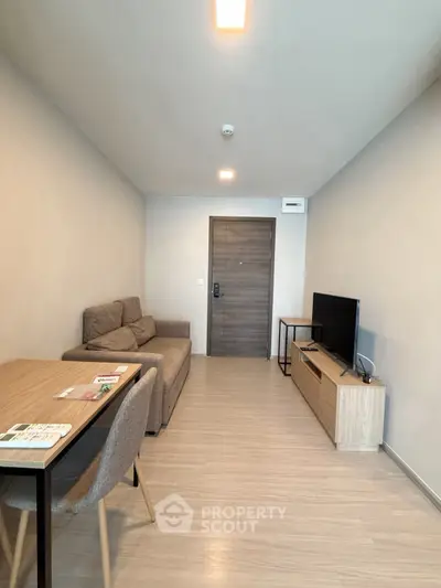 Modern living room with cozy sofa and flat-screen TV in a stylish apartment