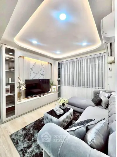 Luxurious modern living room with elegant lighting and plush furnishings