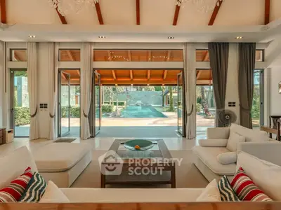 Luxurious living room with pool view and elegant decor