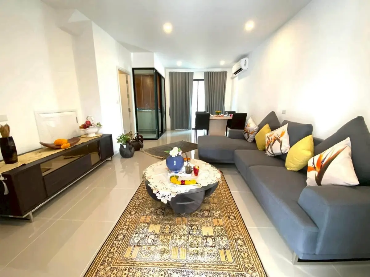 Spacious modern living room with stylish decor and cozy seating area
