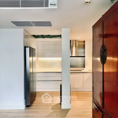 Modern kitchen with sleek cabinetry and stainless steel appliances