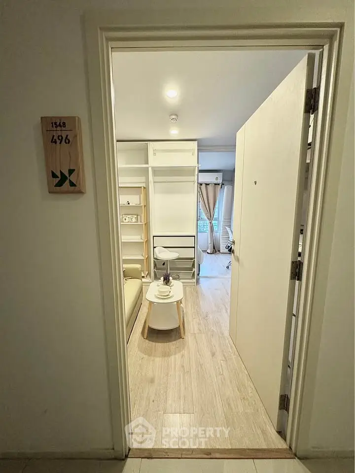 Modern apartment entrance with cozy living area and stylish decor