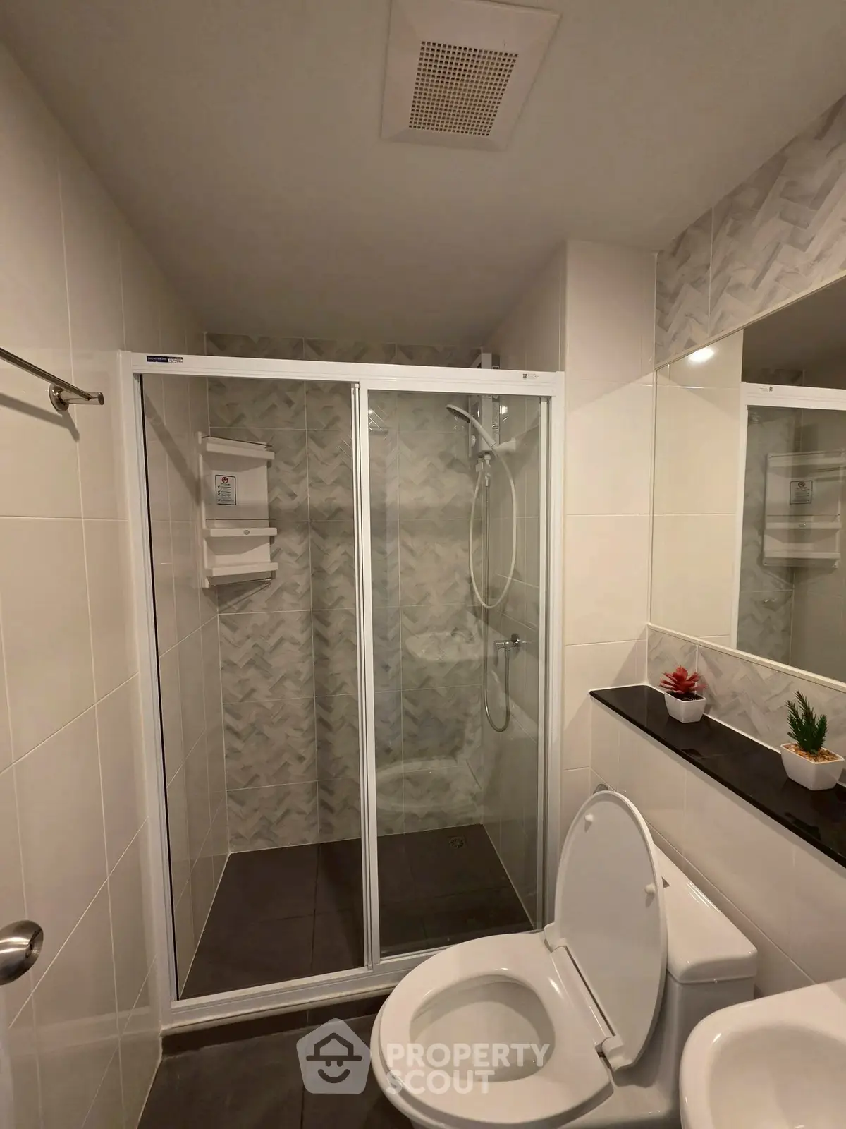Modern bathroom with glass shower and sleek design