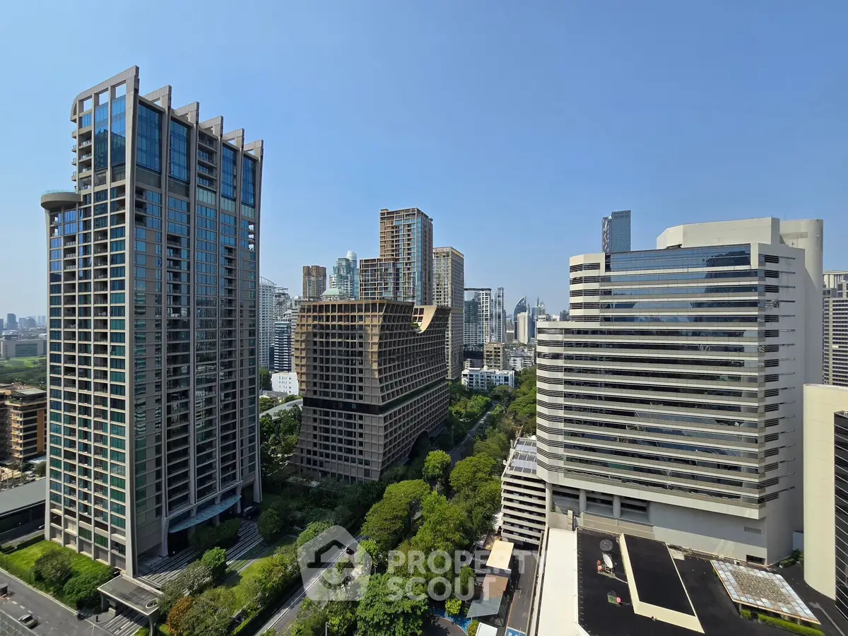 Stunning cityscape view showcasing modern high-rise buildings and lush greenery, perfect for urban living.