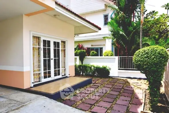 Charming suburban home with lush garden and inviting entrance