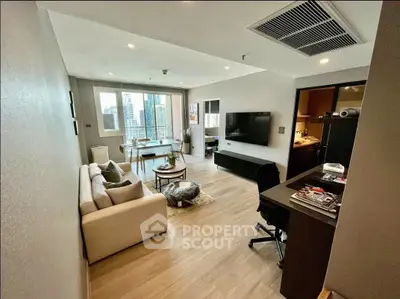 Modern living room with city view, featuring stylish furniture and open layout, perfect for urban living.
