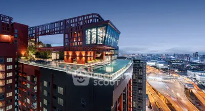 Stunning rooftop pool with panoramic city views on a modern high-rise building.