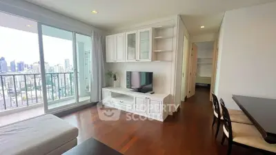 Spacious living room with city view and elegant wooden flooring