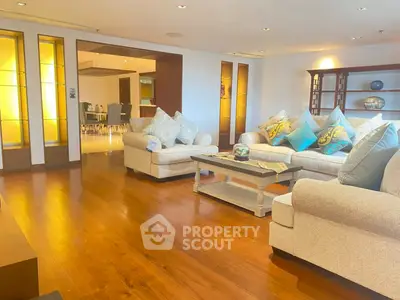 Spacious living room with elegant decor and wooden flooring
