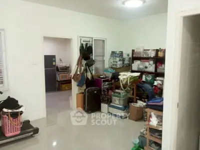 Spacious storage room with organized shelves and ample natural light, perfect for decluttering and organization.