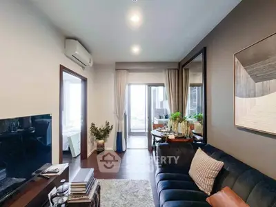 Stylish living room with modern decor and balcony view