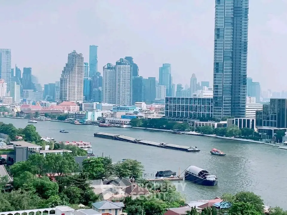 Stunning riverfront cityscape with modern skyscrapers and lush greenery, offering a prime real estate investment opportunity.
