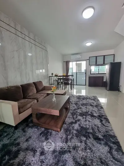 Spacious open-plan living room with modern furniture and elegant decor