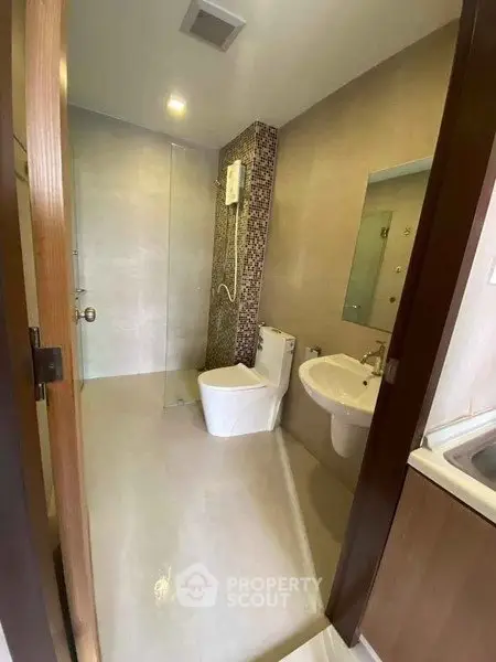 Modern bathroom with sleek design and glass shower enclosure