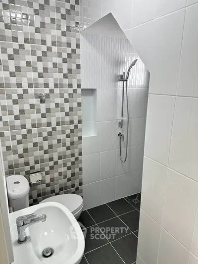 Modern bathroom with stylish tiles and sleek fixtures