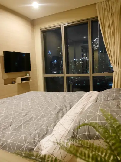 Luxurious bedroom with stunning city view and modern decor
