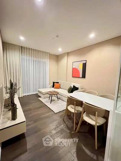 Modern living room with elegant decor and cozy seating area, perfect for relaxation and entertainment.