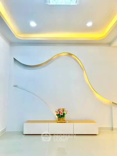 Modern minimalist living room with unique wall design and ambient lighting