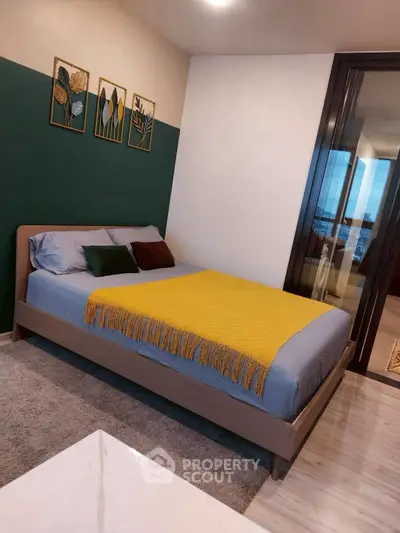 Modern bedroom with stylish decor and large window view