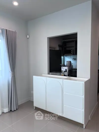 Modern kitchen with sleek cabinetry and open layout design