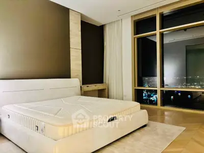 Luxurious bedroom with stunning city view and elegant decor