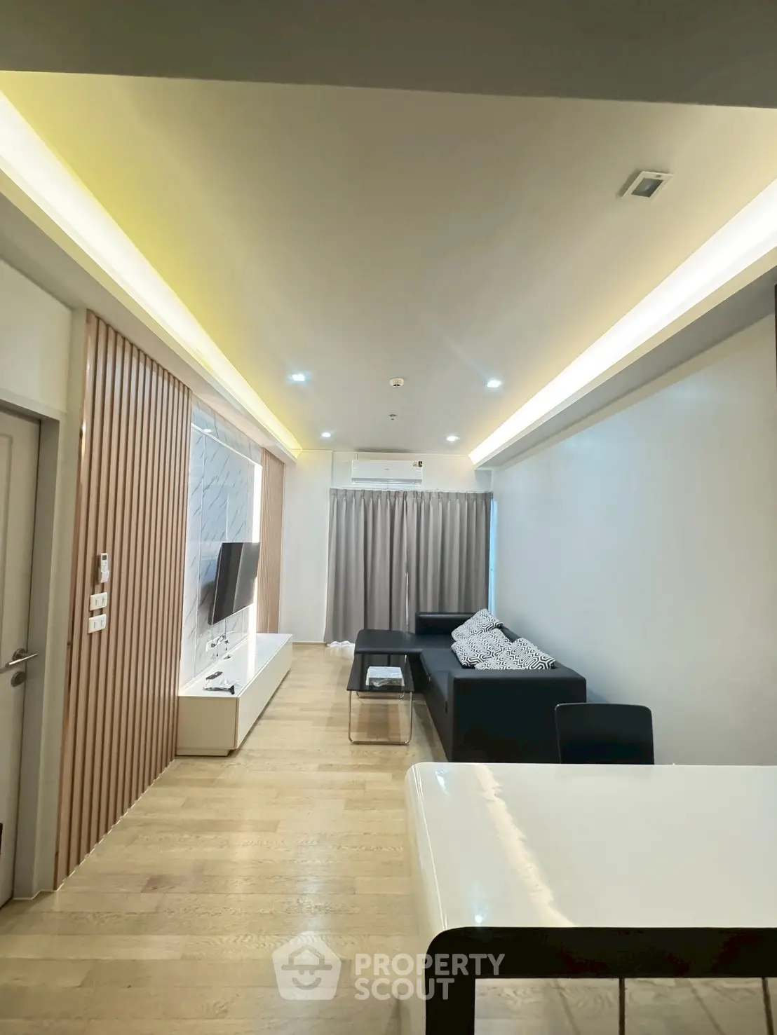 Modern living room with sleek design and ambient lighting