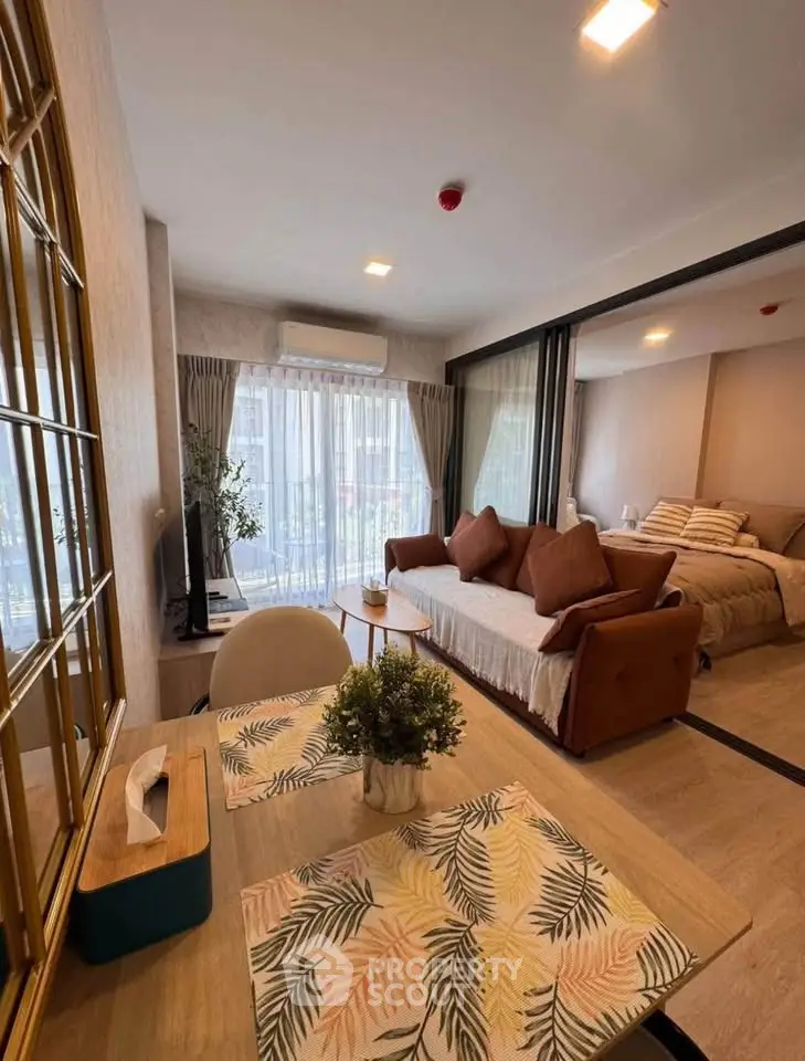 Stylish studio apartment with cozy living area and bedroom, perfect for urban living.