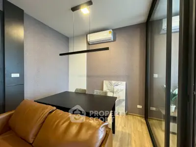 Modern living room with sleek furniture and air conditioning, perfect for urban living.