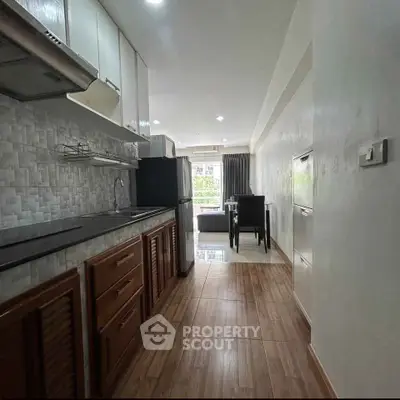 Modern kitchen with open layout and dining area in a stylish apartment