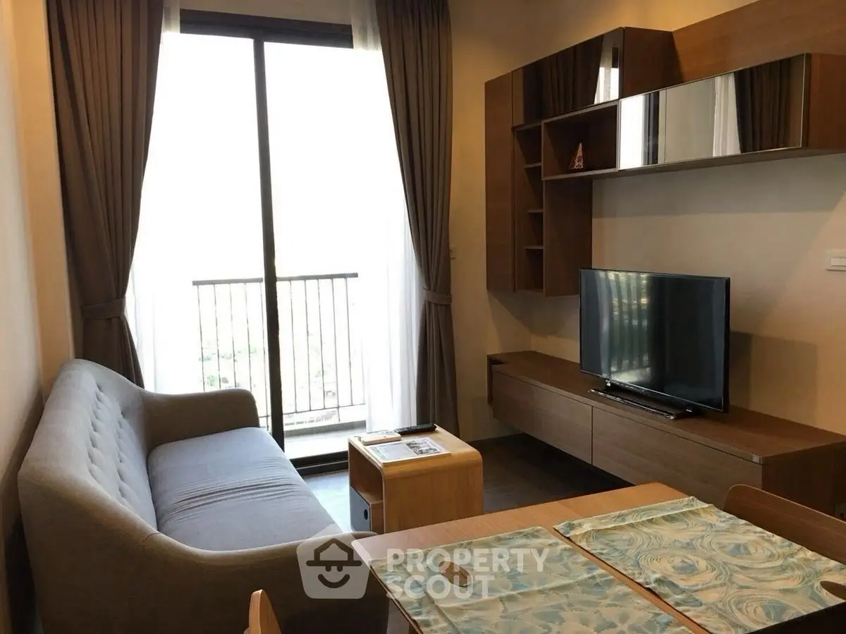 Cozy living room with modern furniture and balcony view