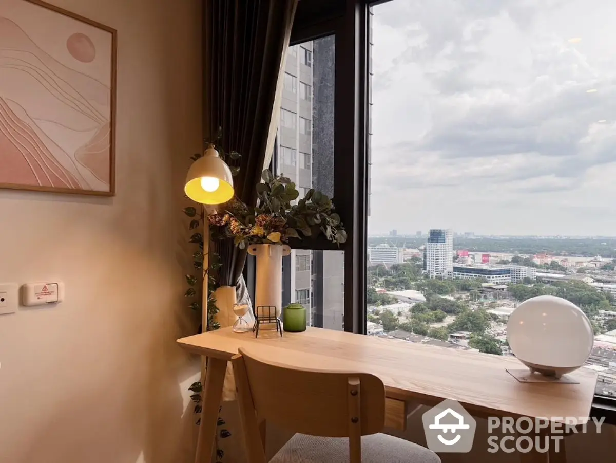 Modern study nook with city view, stylish desk, and elegant decor