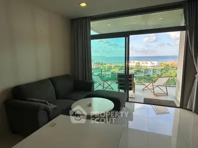 Spacious living room with stunning ocean view and large balcony